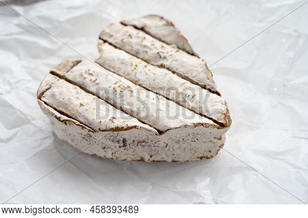 French Heartshaped Neufchatel Cow Cheese With Mold On White Paper, Normandy, France