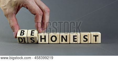 Be Honest Or Dishonest Symbol. Businessman Turns Cubes And Changes Concept Words Dishonest To Be Hon