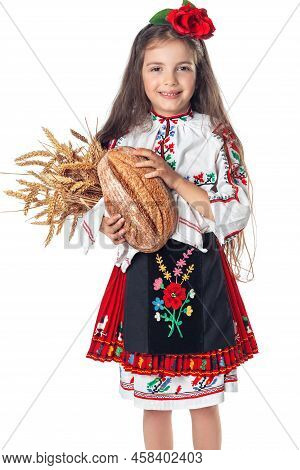 Portrait Of A Beautiful Girl Woman In Traditional Bulgarian Folklore Dress Holding Homemade Bread An