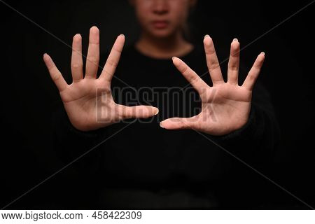 Assertive Woman Making Stop Gesture. Expressing Security, Defense, Restriction And Negative Defensiv