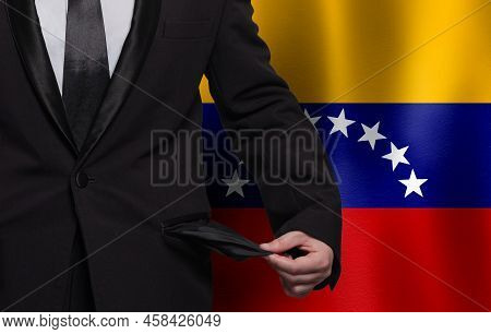 Venezuela Flag Background With Man Showing Empty Pockets. Financial Difficulties, Bad Economy, No Mo