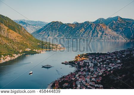 Montenegro Mountains With Boats In The Water Around Kotor