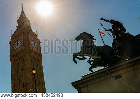 Big Ben, Houses Of Parliament And A Union Jack Flag Flying Behind The Famous Boadicea Or Boudica Sta