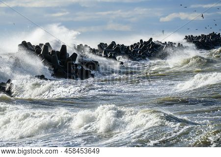 Big Waves Breaking Over Harbor Breakwall In The Baltic Sea