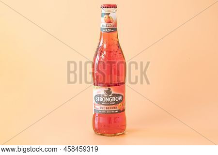 Hereford, United Kingdom  - Jul 16, 2022: A Red Berries Strongbow Apple Bottle Of Cider With White B