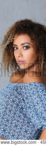 Portrait Of Pretty Young Woman With Curly Hairstyle Posing In Professional Studio. Girl Model Work F