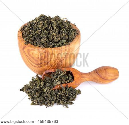 Dry Gynostemma Pentaphyllum Leaf In Olive Bowl And Spoon, Isolated On White Blackground. Jiaogulan O