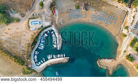 Aerial View Of Coastline Sunset And Landmark White Washed Chapel At Agia Triada Beach, Protaras, Fam