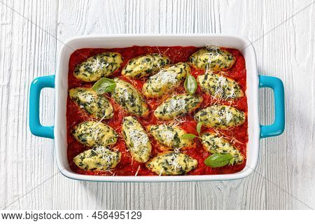 Malfatti, Italian Spinach Ricotta Dumplings  In Tomato Sauce With Herbs And Grated Parmesan Cheese I