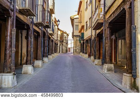 Main Street With Medieval Arcades Made Of Wooden Columns In San Estaban De Gormaz, Soria.