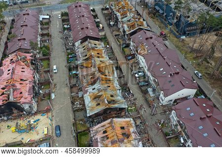 Top View Of The Destroyed And Burnt Houses. Houses Were Destroyed By Rockets Or Mines From Russian S