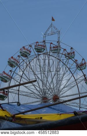 Giant Ferries Wheel With Clear Blue Sky
