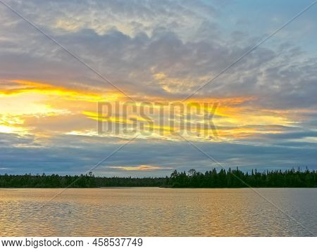 Beautiful Sunset Sky Over The River Reach. Keret River, Karelia, Russia. Sunny Day In July.