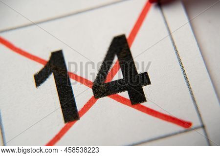 The 14st Number In The Calendar Is Crossed Out With A Red Cross In A Macro On A White Sheet. Calenda