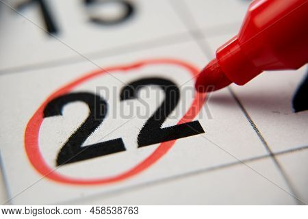 The Calendar 22nd Day Of The Month Is Circled. A Red Marker Circles The Twenty-second Day Of The Mon