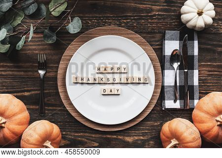 Place Setting With Plate, Napkin, On A  Decorated Table Shot From Flat Lay Or Top View Position. Hap