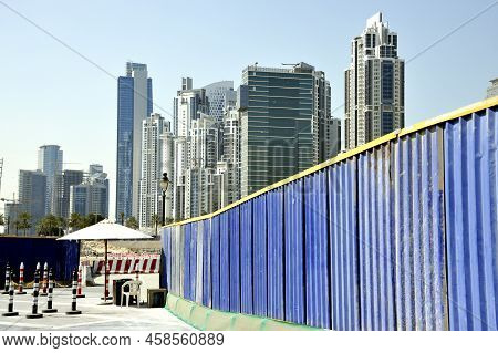 Building Construction Site In Dubai City. The Site Is Protected With A Iron Wall
