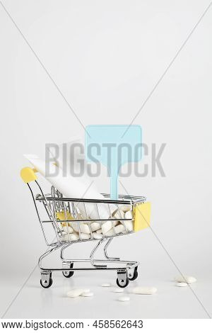 Titanium Dioxide, E171, Dangerous Additive Concept. Gum, Pills, Toothpaste, Cream In Basket And Sign
