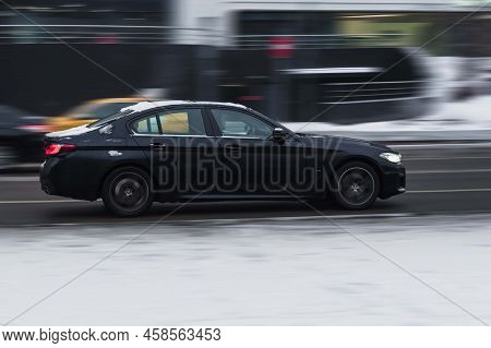 Moscow, Russia - December 2021: High Speed Driving In The City. Black Car Bmw 5 Series G30 Is Drivin