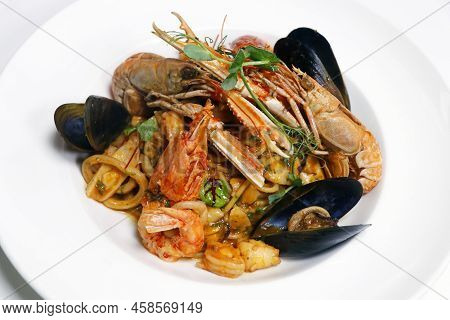 Seafood Linguine Pasta With Langostino, Octopus, Squid Rings, Shrimps, Mussels, Scampi And Clams In 