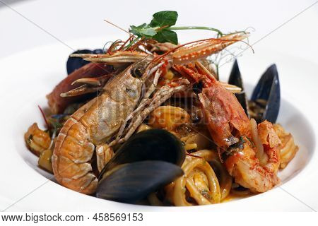 Seafood Linguine Pasta With Langostino, Octopus, Squid Rings, Shrimps, Mussels, Scampi And Clams In 