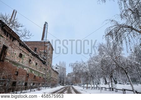 Abandoned Bankrupt Factory, The Stara Pivara (old Brewery) Of Pancevo, Serbia With Its Brick Chimney