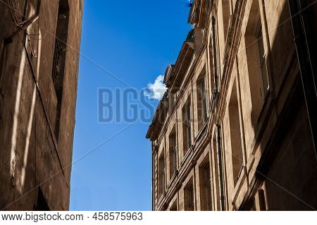 Facade Of A Typical Old French Residential Building In Bordeaux, France, Made Of Freestone, Hosting 