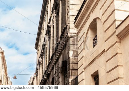 Facade Of A Typical Old French Residential Building In Bordeaux, France, Made Of Freestone, Hosting 