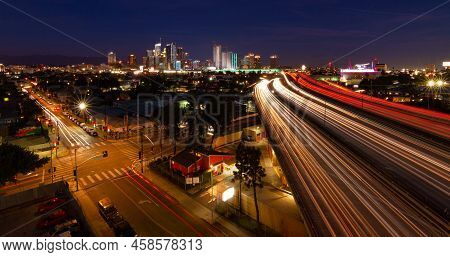 Los Angeles, Ca - June 20 2022:  Local Neighborhood In The Foreground With The I-10 Freeway Leading 
