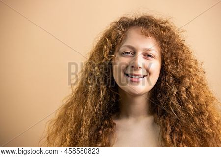 Close Up Pfoto Of A Beauty Smiling Widely Redhead Young Woman With Naked Breast Posing At The Camera