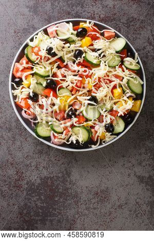 Shopska Salad With Tomatoes, Cucumbers, Onions, Bell Peppers, Olives And Cheese Close-up In A Plate 