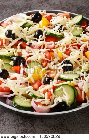 Serbian Salad Called Sopska Salata With Vegetables And Cheese Closeup In The Plate On The Table. Ver