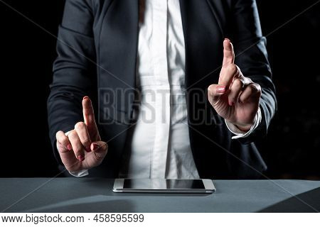 Businesswoman Having Tablet On Desk And Pointing Important Ideas With Two Fingers. Woman With Phone 