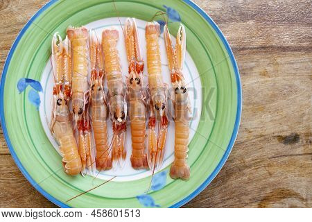 Flat Lay Of Fresh Shrimps On A White Dish