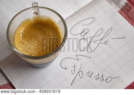 Cup Of Espresso Coffee On A Book With The Written Caffè Espresso