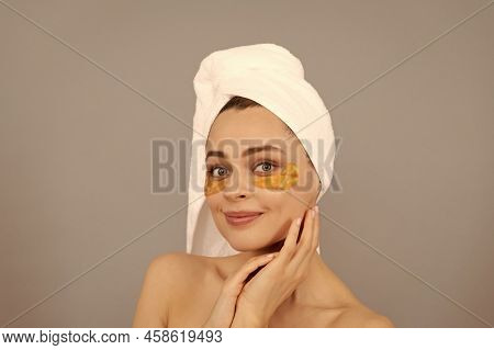 Be Yourself More. Beauty Day In Spa. Applying Golden Anti-fatigue Mask. Girl Reduce Eye Bags.