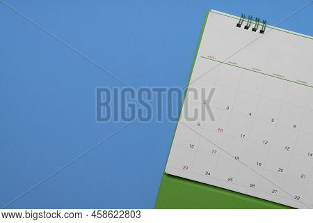Close Up Of Calendar On The Bluel Table Background, Planning For Business Meeting Or Travel Planning