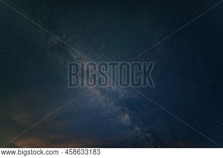 Beautiful Noctilucent Cloud Formations In Night Sky With Milky Way In The Background