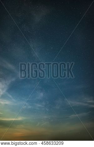 Beautiful Noctilucent Cloud Formations In Night Sky With Milky Way In The Background