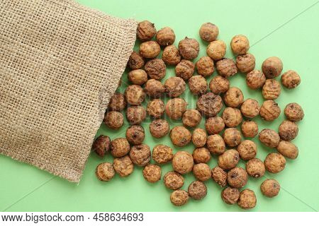 Chufa, Tigernut And Canvas Eco Bag On Green Background With Copy Space For Text. Healthy Organic Veg