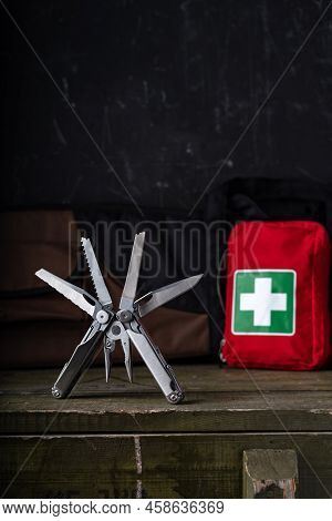 Multifunctional Knife For Hunters And Tourists. Tool And First Aid Kit. Vertical Frame. Front View.