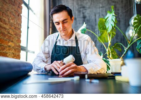 Hobby Became A Small Business Leather Man In Apron Is Making A Leather Wallet And Shooes In Studio
