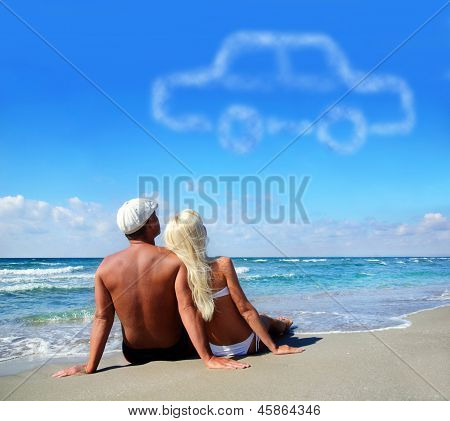 Young Couple On Sea Sand Beach Dreaming About The Own Car