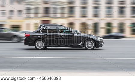 Moscow, Russia - July 2021: Black Bmw 5 Series G30 Car Is Driving On Asphalt City Road