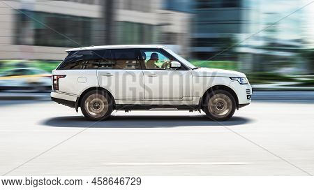Moscow, Russia - August 2021: Range Rover L405 Side View. Sport Suv White Colour Driving Against A B