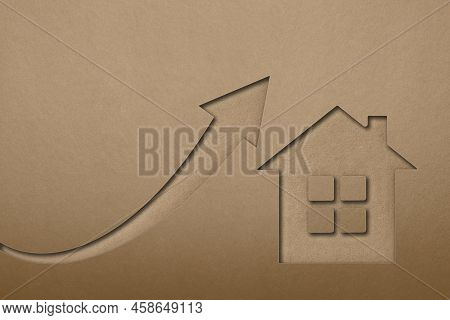 Green Ecological House Symbol. The Value Of Ecological Real Estate. House Symbol On Paper Texture Ba