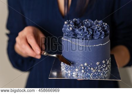 Birthday Cake Held By A Baker In A Bakery. Portrait Of Caucasian Woman Sharing Fresh Cake. Chef Hold