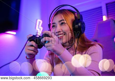 You Win. Gamer Using Joystick Controller Plays Online Video Game With Computer Neon Lights Very Dete