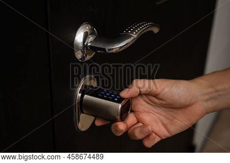 Woman Opens The Combination Lock On The Door To The Apartment. Keyless Entry.