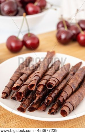 Red Sweet Cherry Pastille Rolls. Handmade Natural Candies For Vegetarians. Dehydrated Mashed Berries